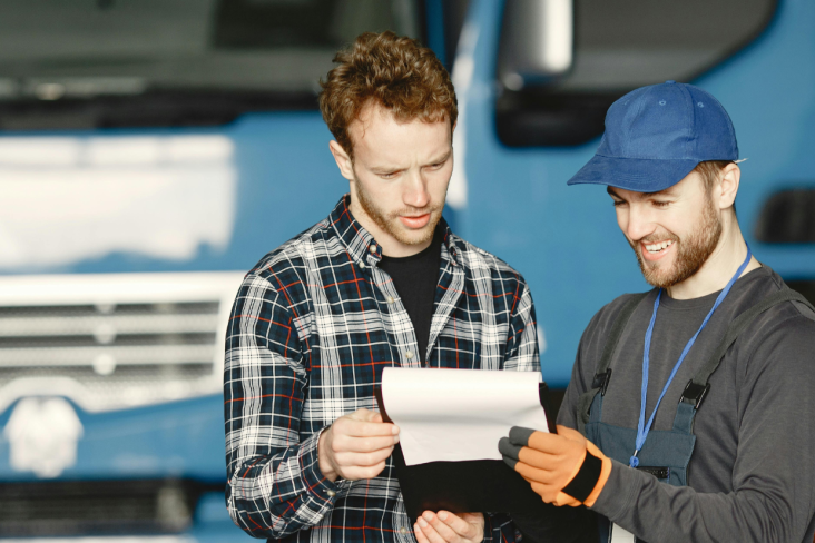 Mechanic talking with customer