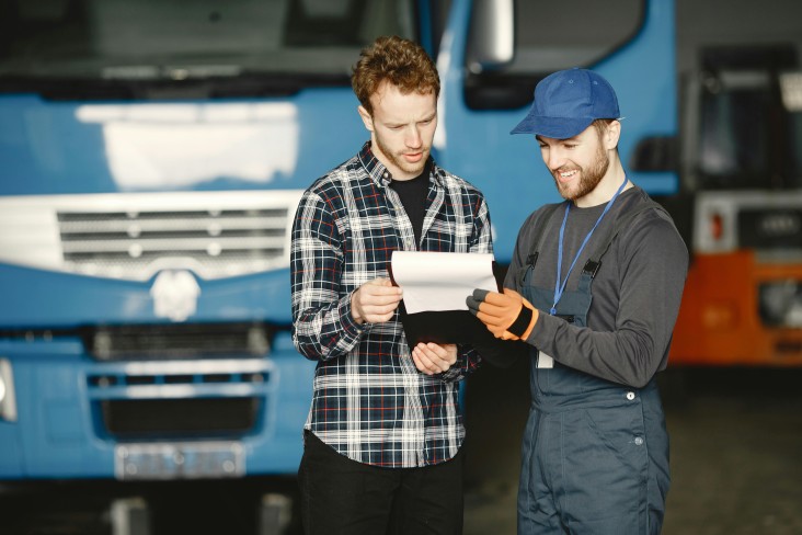 Mechanic talking with customer
